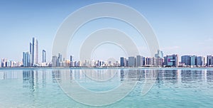 Panoramic view of Abu Dhabi Skyline UAE with skyscrapers and sea