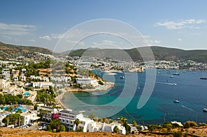 Panoramic View of Aegean sea, traditional white houses marina and Bodrum Castle in Bodrum city of Turkey.