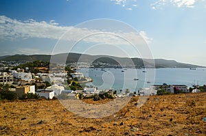 Panoramic View of Aegean sea, traditional white houses marina and Bodrum Castle in Bodrum city of Turkey.