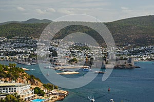 Panoramic View of Aegean sea, traditional white houses marina and Bodrum Castle in Bodrum city of Turkey.