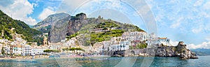 Panoramic view, aerial skyline of small haven of Amalfi village with tiny beach and colorful houses, located on rock, Amalfi coast