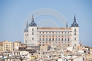 panoramic view of the Alcazar of Toledo and part of the surrounding houses one sunny and torrid afternoon