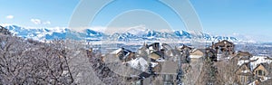 Panoramic view of Alpine Utah with snowy mountains and houses in winter photo