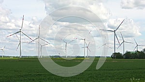 Panoramic view on alternative energy wind mills in a windpark in northern europe