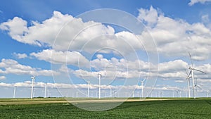 Panoramic view on alternative energy wind mills in a windpark in northern europe