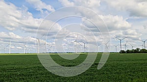 Panoramic view on alternative energy wind mills in a windpark in northern europe