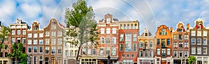 Panoramic view of Amsterdam houses and rooftops. No logos and inscriptions. Amsterdam, Holland, Netherlands, Europe