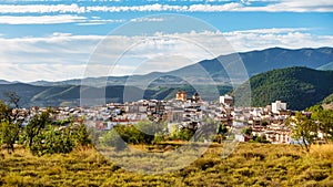 Panoramic view of the Andalusian white village next to the high mountains that surround it, Velez Rubio, Almeria. photo