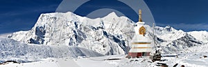 Annapurna range from Ice Lake and stupa photo
