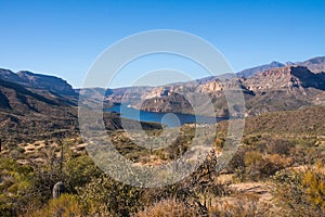 Panoramic view on Apache trail over cactus and rock landscape with lake