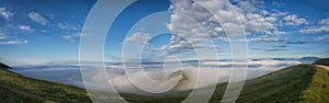 Panoramic view of Apennines in a foggy day, mount Cucco, Umbria, Italy