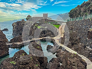 Porto Moniz - Panoramic view of the aquarium in coastal town Porto Moniz, Madeira island, Portugal, Europe. Stone castle photo