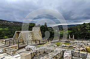 Panoramic view of the archaeological site of Knossos. The sacred Bull Horns sculpture symbol of power for the Minoans in the bac