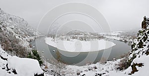 Panoramic view of Arda river in Rodopi Mountains. Kardzali province, Bulgaria, in snowy winter day