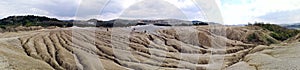 Panoramic view of an arid landscape at the Mud Volcanoes