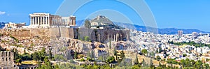 Panoramic view of Athens, Greece. Famous Acropolis hill rises above cityscape