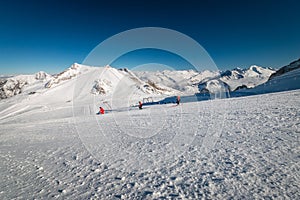 Panoramic view of Austrian ski region of Hintertux Glacier in the region of Tyrol with incidental skiing people