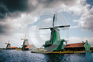 Panoramic view of Authentic Zaandam mills in Zaanstad village on the river Zaan. photo