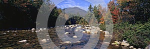 Panoramic view of an autumn waterway along the Kancamagus Highway in the White Mountain National Forest, New Hampshire photo