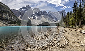 Panoramic view of azure blue coloured lake and mountains at Moraine Lake, Rocky Mountains, Alberta, Canada