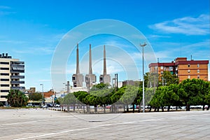 Panoramic view of Badalona, Barcelona, Spain with the thermal power plant, three chimneys in the background