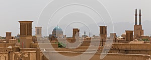 Panoramic view of badgirs and mosques of Yazd photo