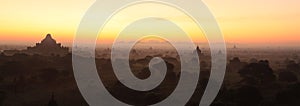 Panoramic view of Bagan during sunrise. Majestic Dhammayan Gyi temple. photo