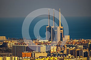 Panoramic view of Barcelona, â€‹â€‹with three chimneys in the background, remains of a thermoelectric plant.