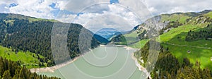 The panoramic view of the Barrage de Saint Guerin in the middle of the mountains in Europe, in France, towards Beaufort, in the