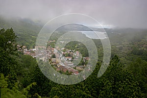 Panoramic view of BaÃÂ±os de Montemayor north of Extremadura on a cloudy day with green vegetation photo