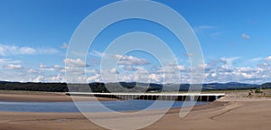 Panoramic view of the beach at arnside with the leven railway viaduct and river in the south lakes area of cumbria