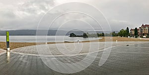 Panoramic view of the beach in Kelowna on overcast rainy day