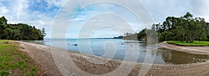 Panoramic view of a beach littered with pebbles