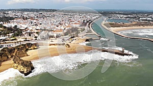 Panoramic view of the beach, marina and cityscape, Lagos, Algarve, Portugal. Aerial froward