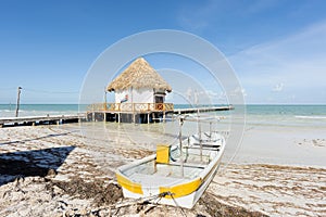 Panoramic view of the beach with wooden pier in Holbox