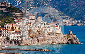 Panoramic view of beautiful Amalfi white houses on hills leading down to coast, Campania, Italy