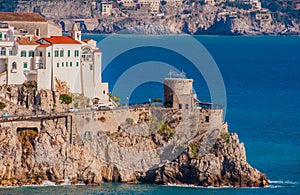 Panoramic view of beautiful Amalfi white houses on hills leading down to coast, Campania, Italy