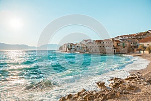 Panoramic view on a beautiful beach of a small town Postira - Croatia, island Brac photo