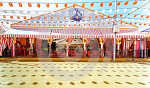 Panoramic view of Beautiful decorated Caseta `fair tent` at the April Fair Feria de Abril, Seville Fair Feria de Sevilla, And photo