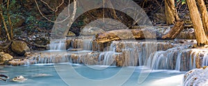 Panoramic view of beautiful deep forest Erawan waterfalls in Thailand