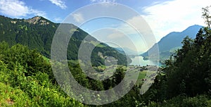 Panoramic View of beautiful mountain and valley with lake in Switzerland.