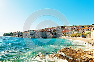 Panoramic view on a beautiful pebble beach of a small town Postira - Croatia, island Brac