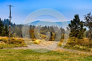 Panoramic view of Beskidy Mountains towards Babia Gora seen from Potrojna peak in Little Beskids in Poland