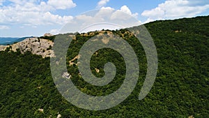 Panoramic view of Black Sea coastline mountains and yellow hills on a sunny autumn day, hiking and nature concept. Shot