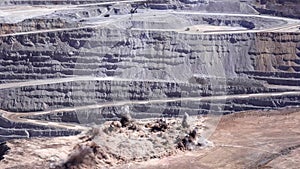 Panoramic view of the blasting process in an open pit mine
