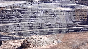 Panoramic view of the blasting process in an open pit mine