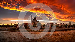 Panoramic view of bloody sunset in front of cathedral in Magdeburg, Germany