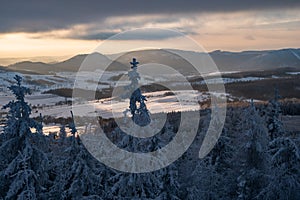 Panoramic view from Borowa Gora view point during winter time. Frosty structure, glazed, icy branches.