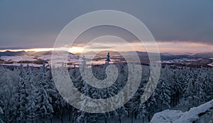 Panoramic view from Borowa Gora view point during winter time. Frosty structure, glazed, icy branches.