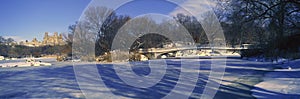 Panoramic view of bridge over frozen pond in Central Park, Manhattan, NY on upper west side near Central Park West photo